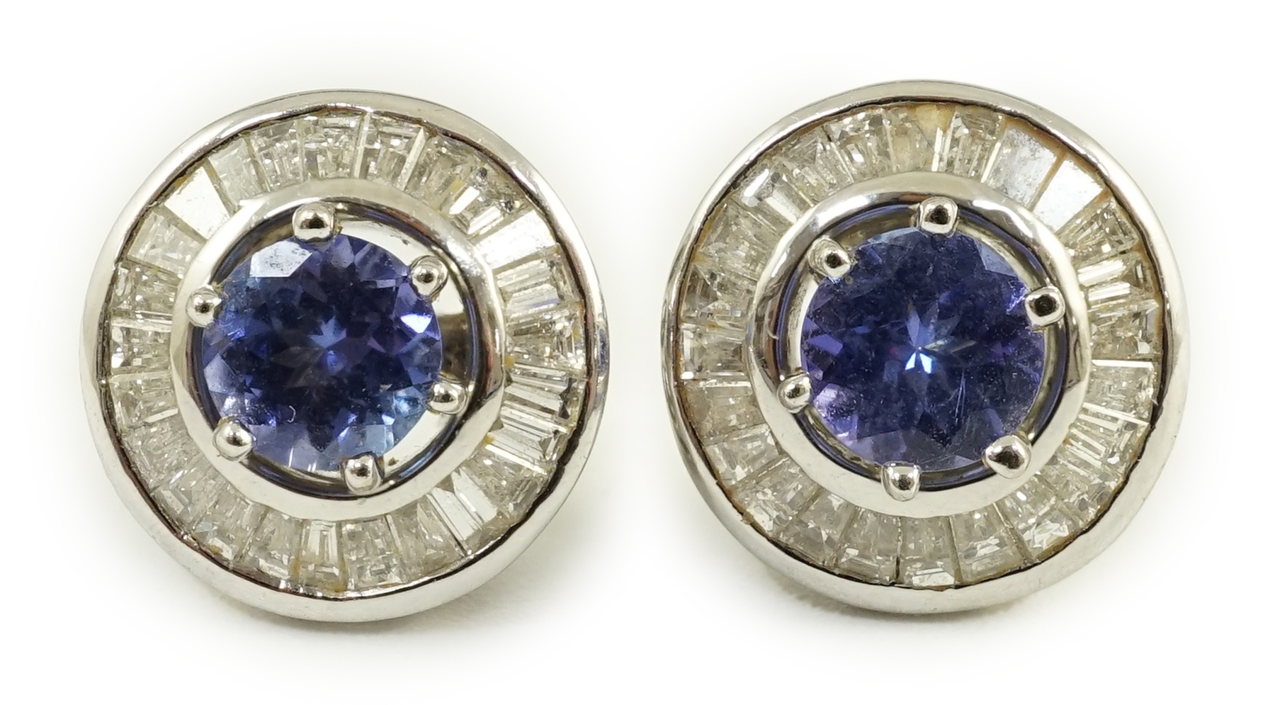 A modern pair of 750 white gold, tanzanite and diamond cluster set earrings